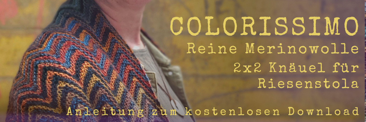 Nahaufnahme einer gestrickten Stola im Zickzack Muster, Schriftzug: Colorissimo, 2mal 2 Knäuel für Riesenstola