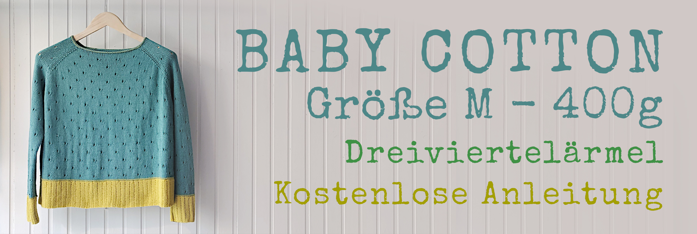 Jadefarbener Raglanpullover mit gelben Bündchen auf Holzbügel, Schriftzug: Baby Cotton, Größe M, kostenlose Anleitung