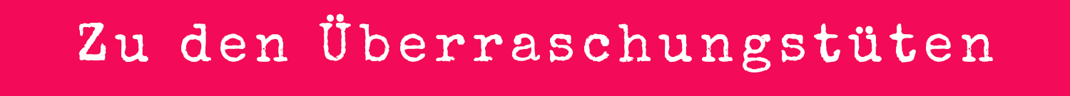 Weiße Schrift auf Pink: Zu den Überraschungstüten