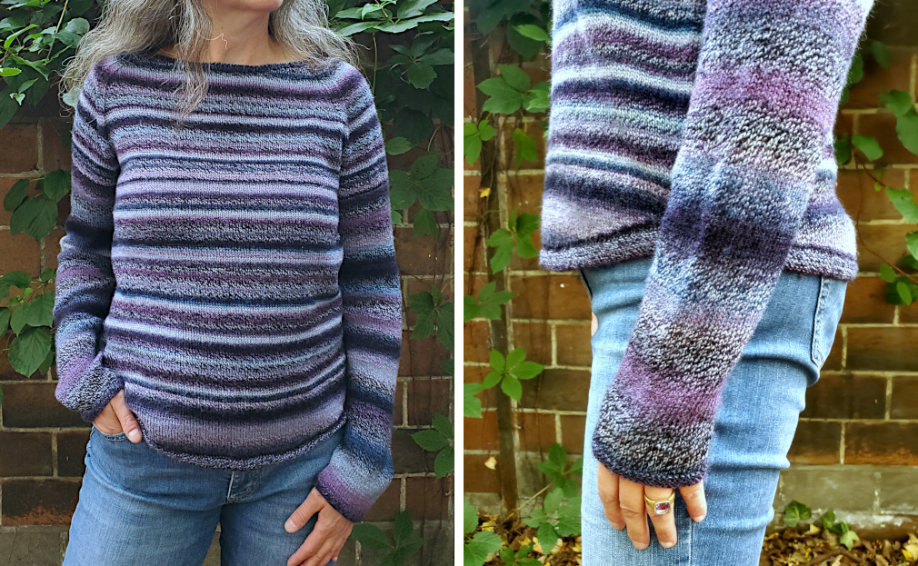 Modell trägt Raglanpullover mit abgerundeten Säumen in blau-violettem Farbverlaufsgarn.